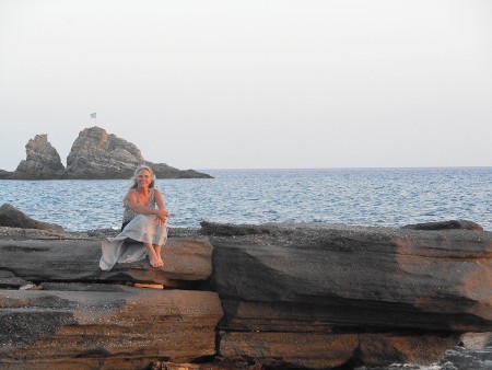Rocks on the beach of Sidonia, Crete, with tourist.